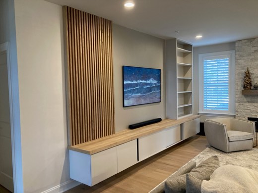 Floating media cabinet with slatted wood accent wall