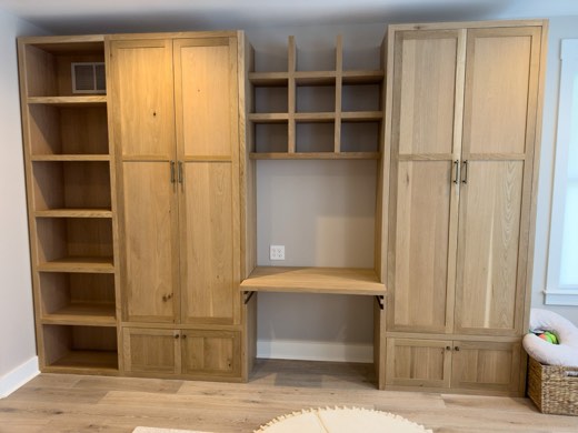 White oak wardrobe built-ins with desk nook